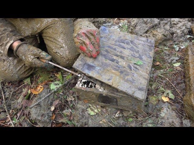 Heavy boxes in the German dugout excavations with metal detector