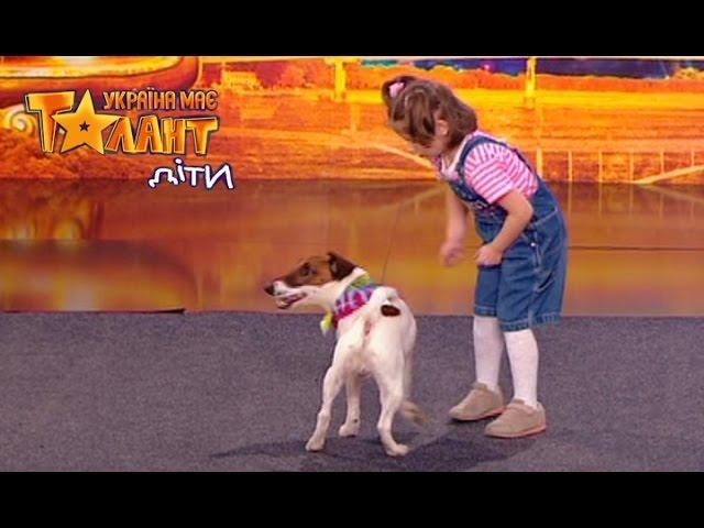 The girl plays with trained dog. Ukraine's Got Talent KIDS