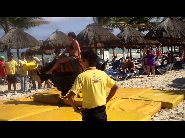 Tammy riding mechanical bull in Cancun