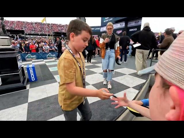 Brexton Busch signing autographs in Victory Lane