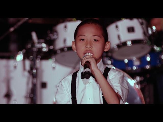 Danny Chu -  The Show Must Go On -Queen-  8 year old Charms and brings a smile to all!