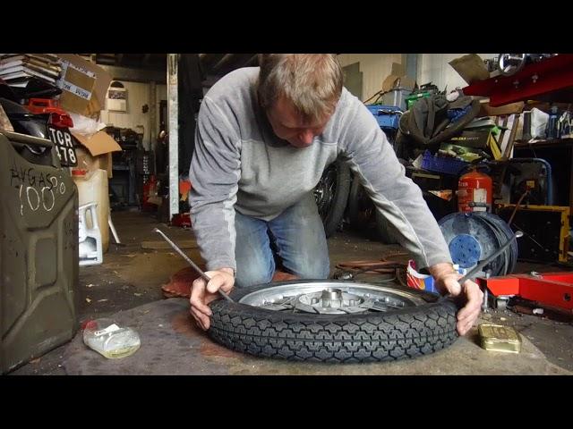 Fitting a motorcycle tyre and tube at Performance Classics.