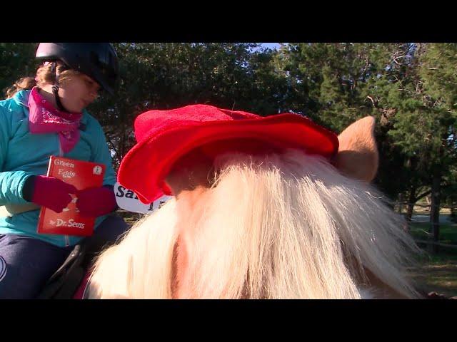 Kids read to horses at RED Arena to celebrate Dr. Seuss's birthday