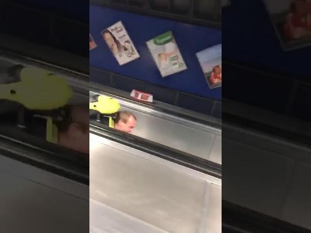 Lad walking down the wrong side of an escalator falls over | CONTENTbible