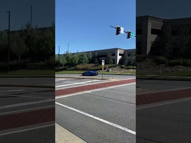 Lamborghini Huracán flyby at car show.