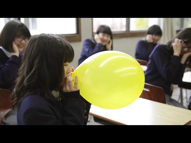 japanese school girls plying with balloons
