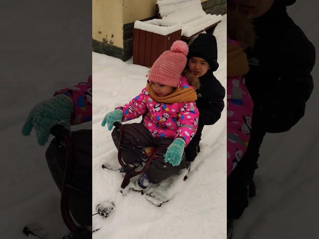 Adamo with Alyona sledding 