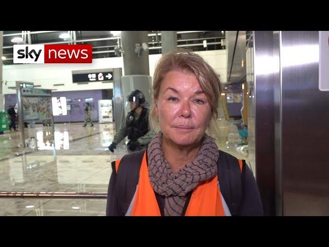 Sky journalist confronts Hong Kong riot police officer