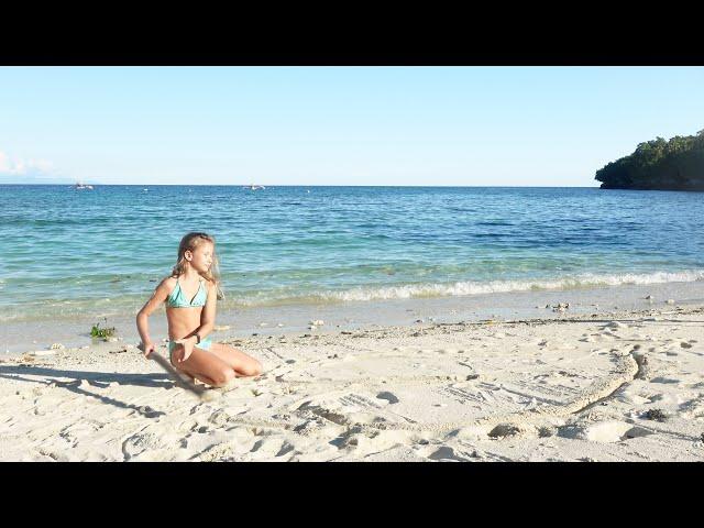 Children playing on the beach. August on the Philippines. 4k