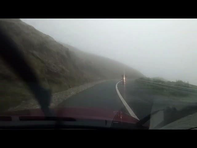 Driving Keem Strand - Keel Mountain Road in Achill Island during cloudy conditions.