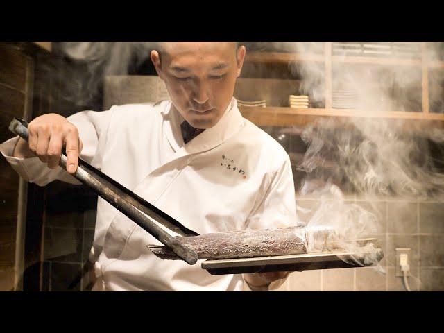 Amazing sushi chef like a samurai! Craftsmanship with fish and charcoal fire