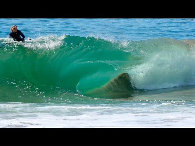 Surfers Try to Ride Dangerously Shallow Wave on a Disappearing Sandbar