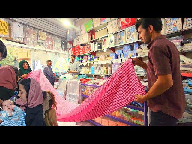 Zuleikha's preparation for the birth of a baby.  Hassan and Zulikha go to the store to buy clothes