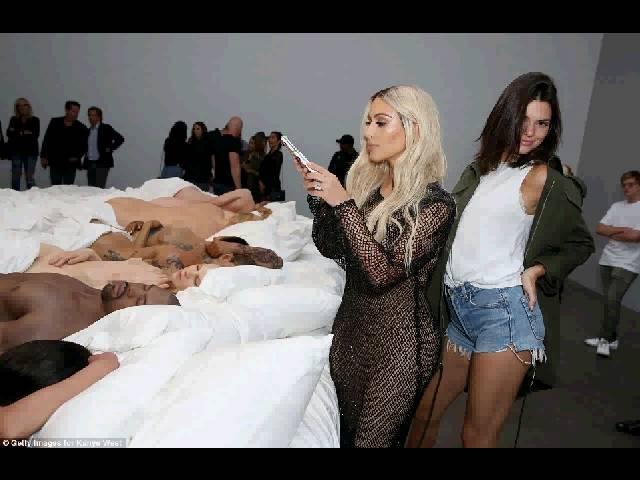 Kim stands over naked figure of HERSELF in bed with Trump