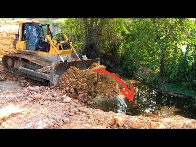 Wonderful Stronger Bulldozer KOMATSU DX65P Working push soil filling up/Heavy Dump truck unloading.