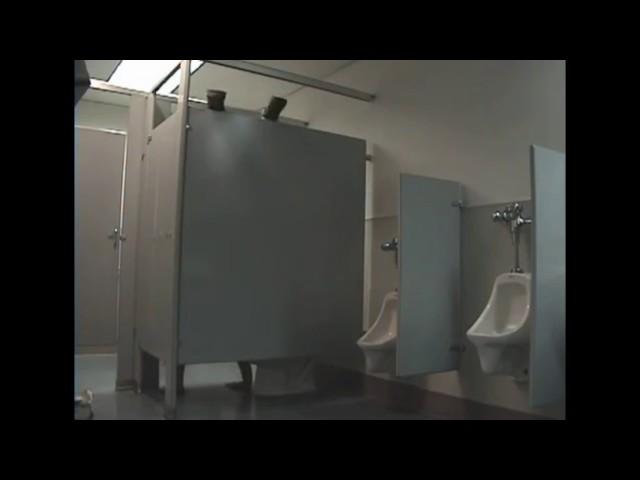 Jason Bourne shits over a stall