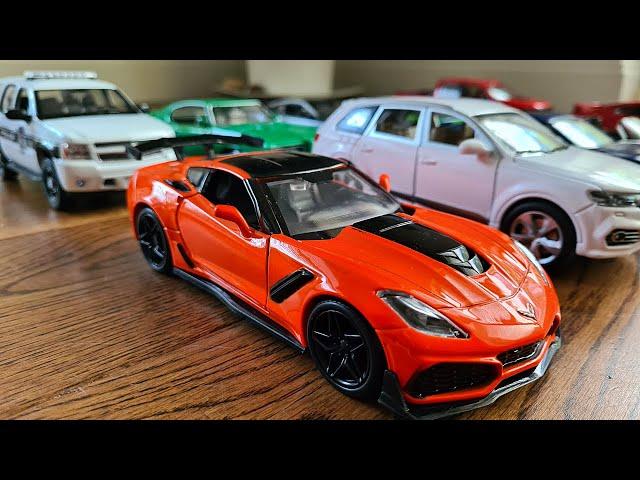 Large diecast cars being driven by hand on the floor  * - MyModelCarCollection