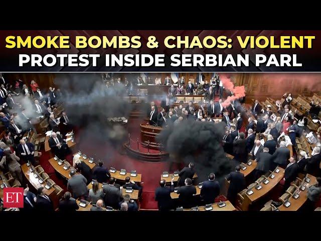 Chaos in Serbian Parliament as opposition MPs hurl smoke grenades to protest govt policies