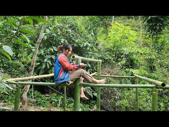 single girl alone - building bamboo house