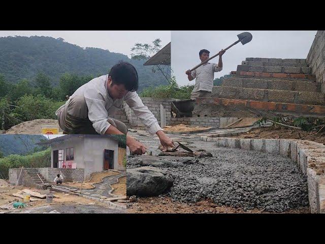 Pour concrete and use stream rocks to landscape the walkway.