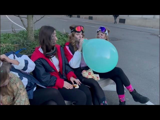 Girls have Fun with balloons during Fasnacht in Germany (preview clip)