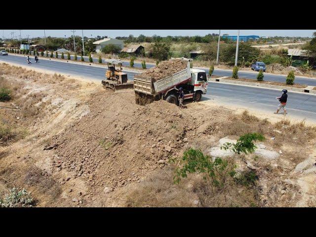 Best Land filling process Dump Trucks With D31P KOMATSU Dozer filling Flooded land Next to the road