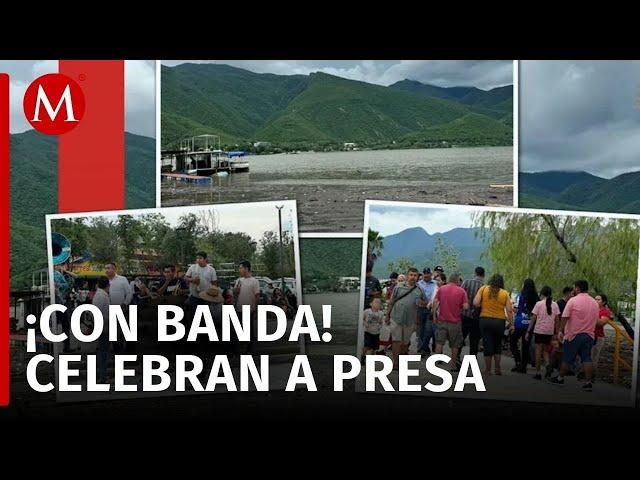 ¡Con todo y banda! Cientos celebran en presa La Boca tras lluvias por 'Alberto'