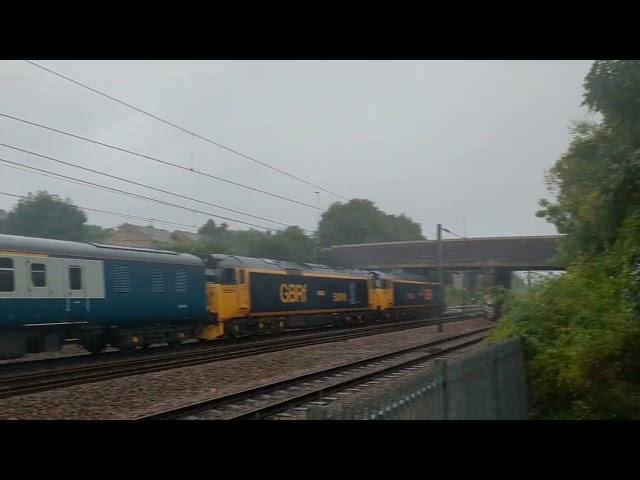 Two class 50s thunder through a very soggy Stevenage.