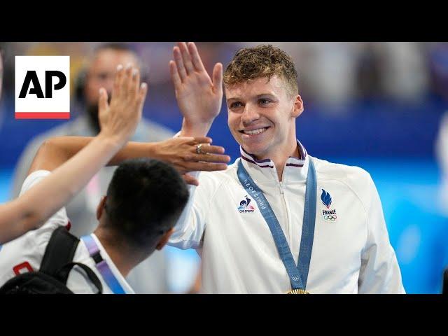 WATCH: French fan zone explodes in cheers as Leon Marchand wins Olympic gold