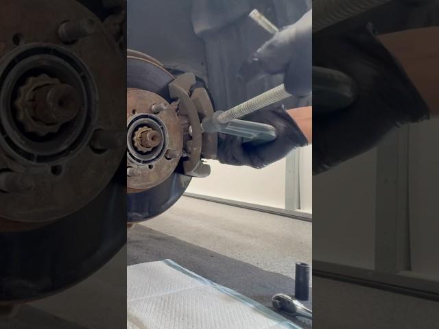 Using a C-clamp to decompress the brake piston on a Toyota Corolla brake job #brakepads #diy