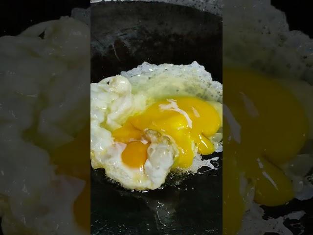 Scrambled eggs with toast bread in a pan