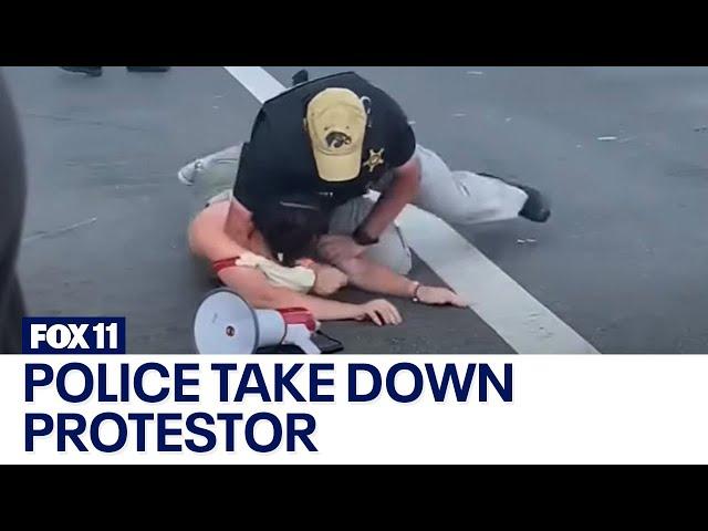 Police take down protestor approaching POTUS motorcade at Summit of the Americas