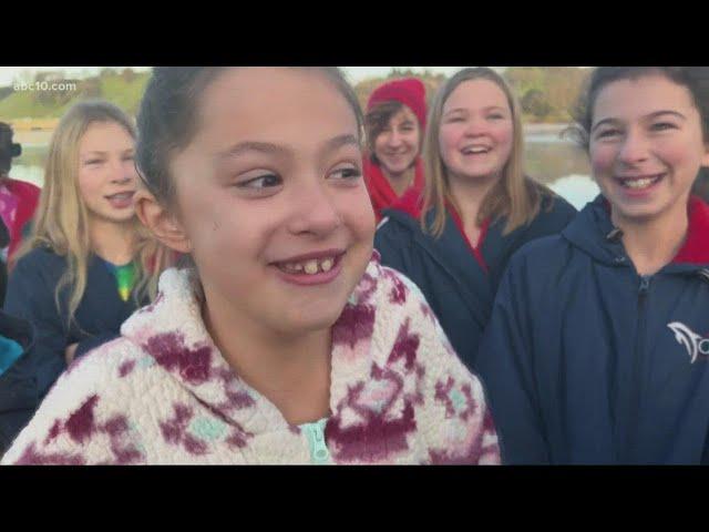 Local swim team continues 30-year tradition of jumping into Lake Natoma