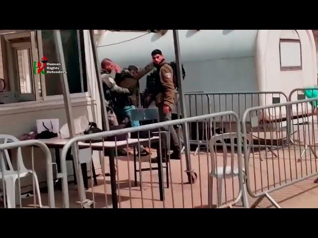 Israeli soldiers humiliate Palestinians before they enter the Ibrahimi Mosque to pray in Hebron