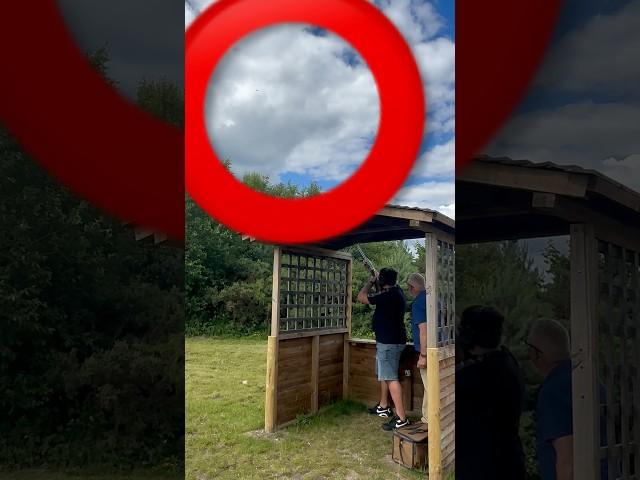 Hit corner of a clay pigeon during sporting shotgun shooting