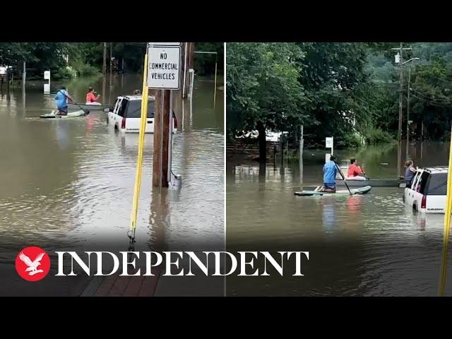 Residents kayak through flooded town as Vermont hit by severe flooding