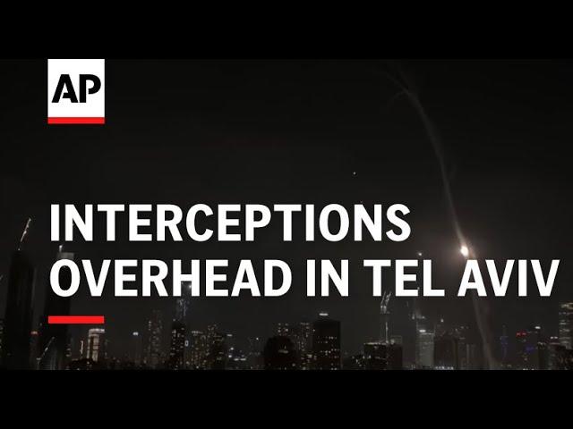 Interceptions overhead in Tel Aviv following an Iranian missile attack on Israel