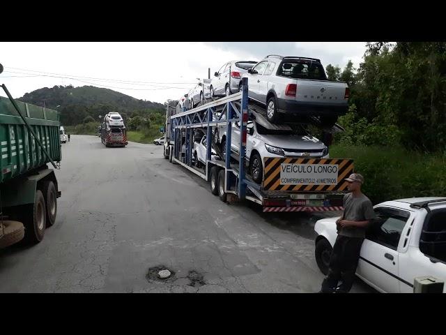 Cegonheiro saindo do carregamento fazendo um tour até o pátio sindicato