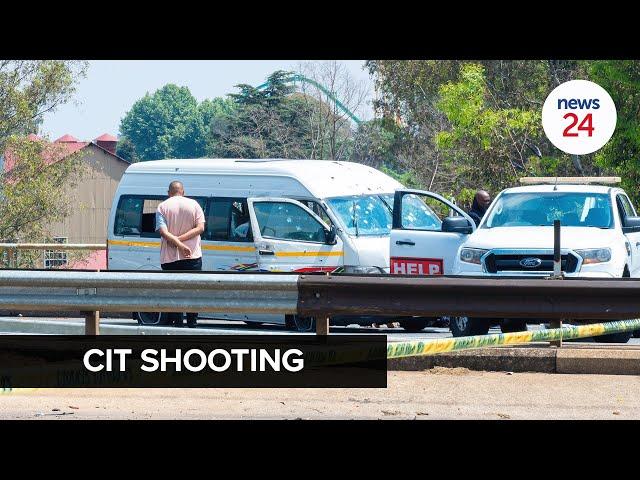 WATCH | Joburg CIT shooting: Robber's body lay uncovered on the road next to bullet-riddled taxi