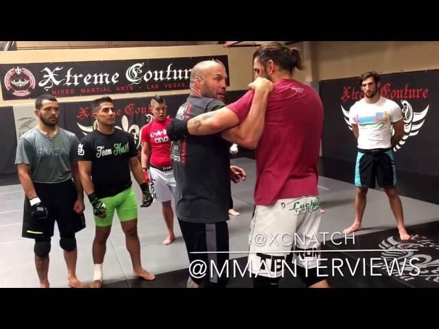 Randy Couture showing some clinch technique at Xtreme Couture for the pro practice