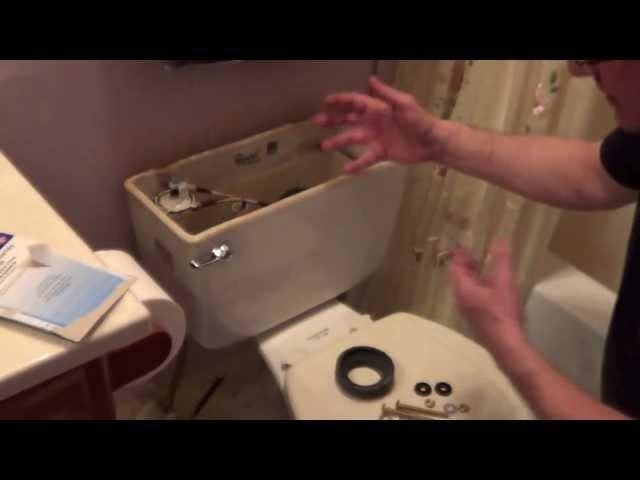 How To Fix a Leaking Toilet Tank - Toilet Tank Repair - Remove Rusted Toilet Bolts