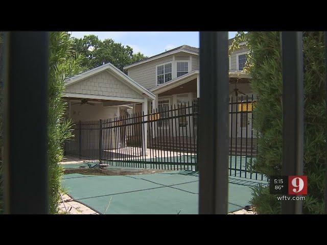 Video: Property owner builds fence through pool | WFTV