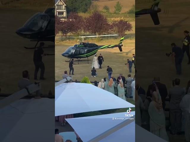 Epic bridal entrance in helicopter at Three Rivers Country Club, Essex | Wedding Car Hire