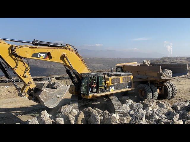 Caterpillar 385C Excavator Loading Rocks On Caterpillar Dumpers - Sotiriadis/Labrianidis Mining