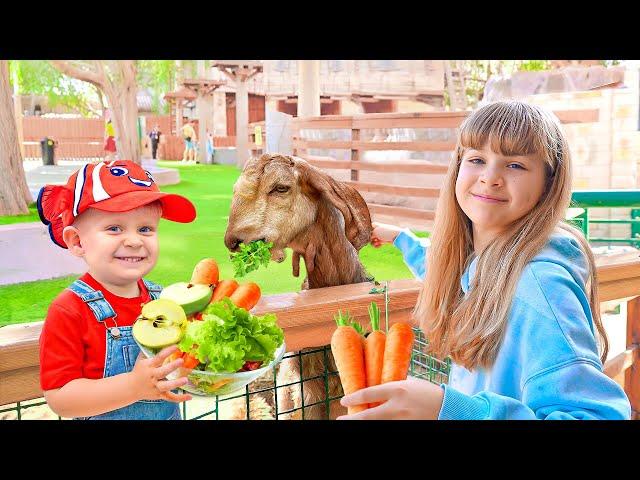 Diana & Roma feed the Animals at the Emirates Park Zoo