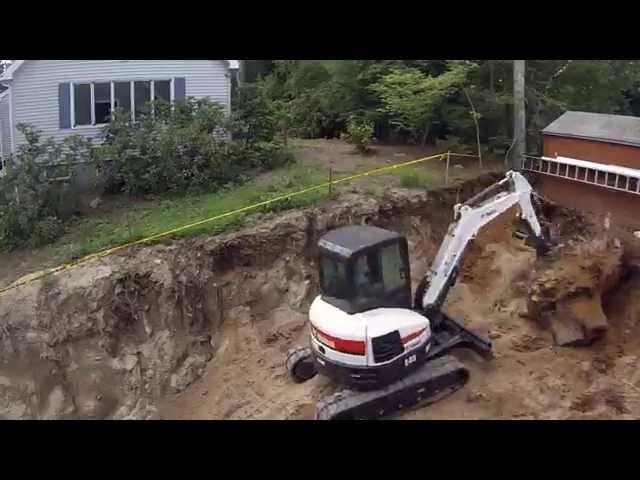 Bobcat E45 Digging Up Big Stump