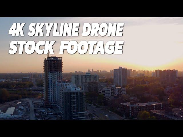 Drone Stock Footage In 4K Ascending Up Over An Urban Sunset