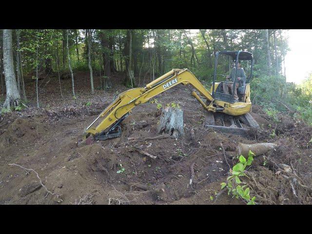 Installing a new driveway up steep terrain, camper pad, land clearing