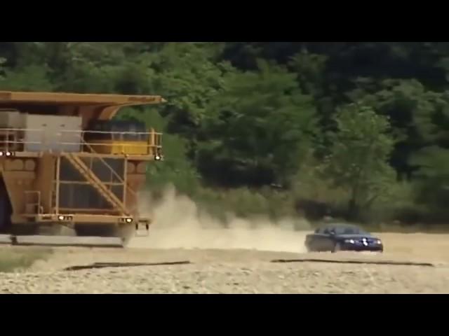 LARGE DUMP TRUCK CHASING A TINY CAR   SCARY