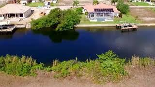 Exceptional triple lot on 120’ Wide Gulf Access Canal